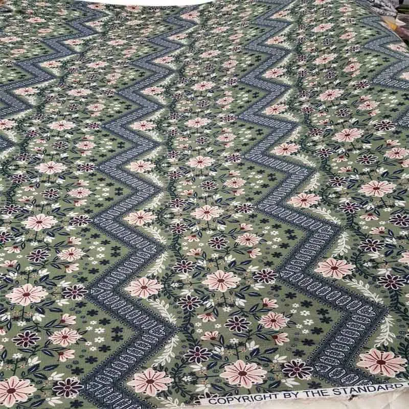 Corrugated Rayon Full Of Pink Flowers On A Light Olive Green Background Fabric 58" Wide